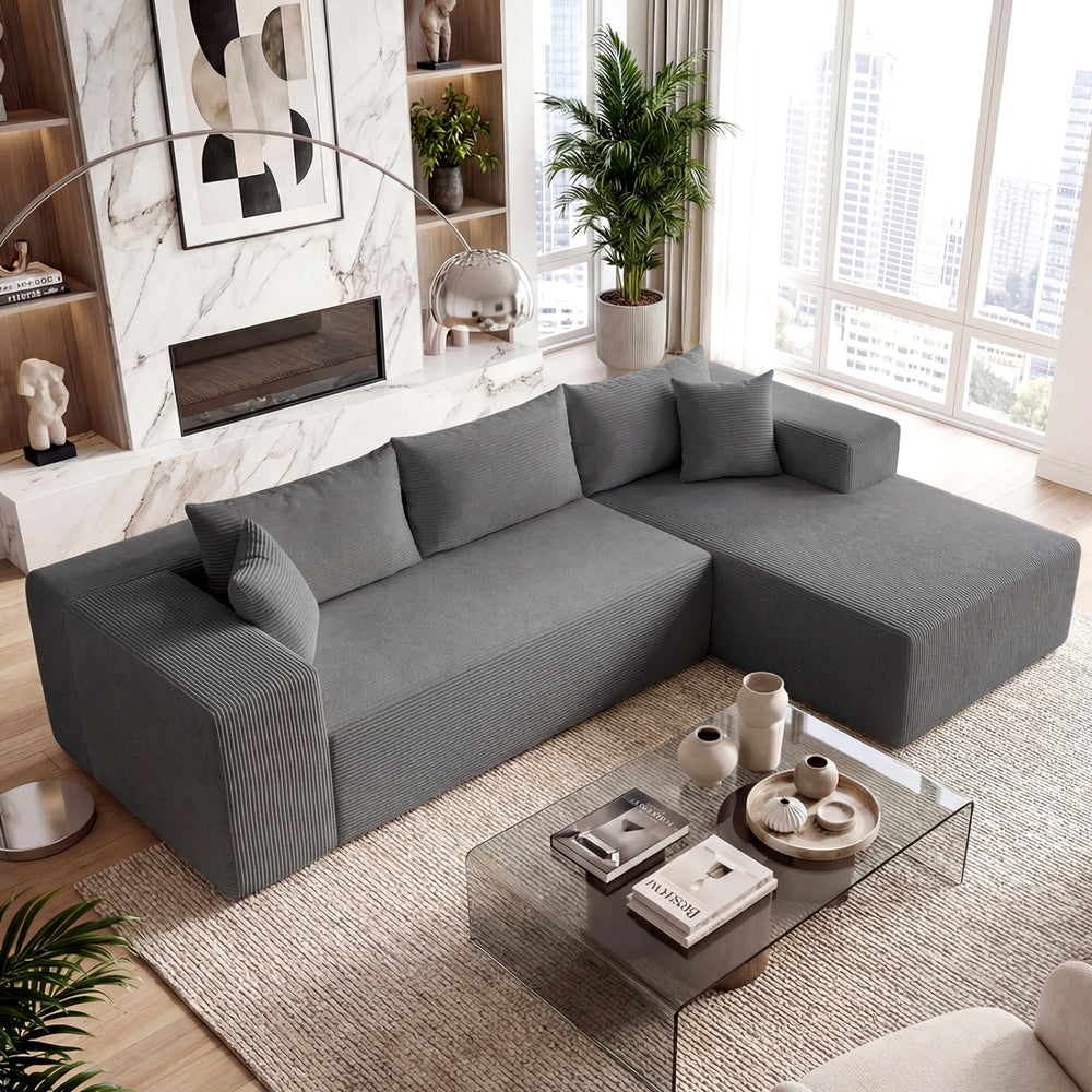 L-shaped gray modular sectional sofa with corduroy upholstery, deep seats, and supportive backrests for ergonomic.