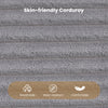 Close-up of skin-friendly corduroy fabric in gray, showcasing its breathable and wear-resistant texture for comfort.