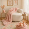 Moon-shaped single sofa chair in beige teddy fleece with a cozy throw, perfect for relaxation in a stylish living space.