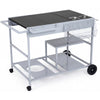 Movable grill table with spacious black tabletop, stainless steel condiment caddies, and storage for BBQ essentials.