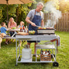 Movable grill table with spacious black tabletop, condiment caddies, and gas tank holder, perfect for backyard BBQs.
