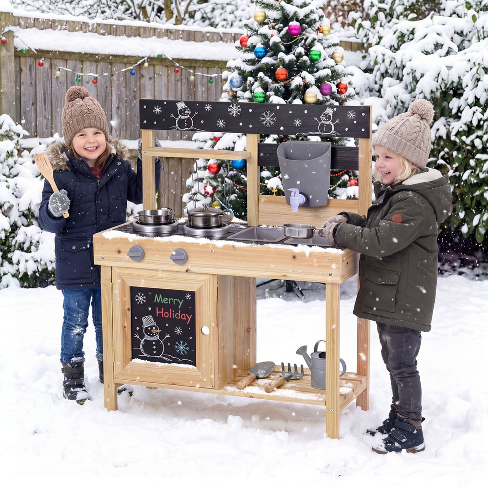 Kids playing with the Mud Kitchen Playset featuring removable sinks, stoves, and kitchenware for outdoor fun.