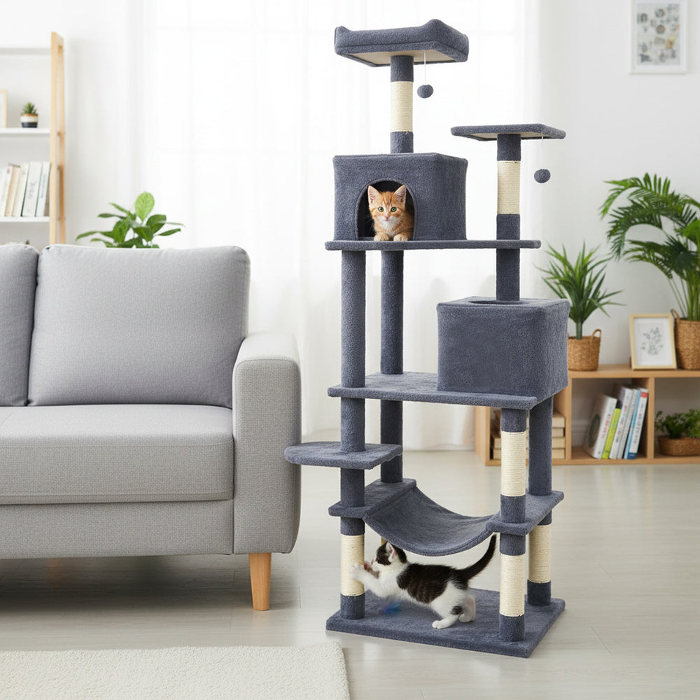 Multi-level dark gray cat tree with two condos, upholstered perch, and scratching posts for climbing and lounging.