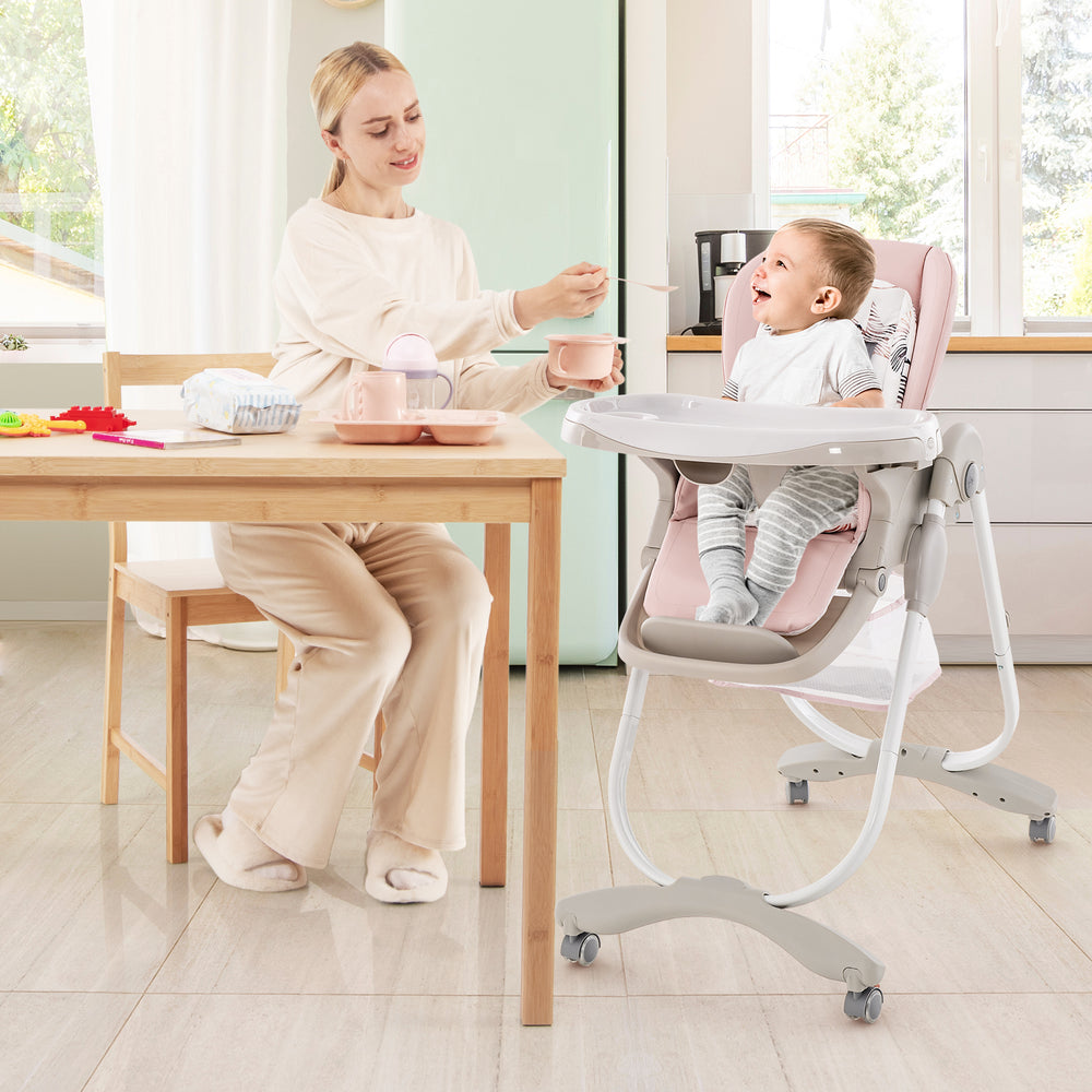Multifunctional pink baby high chair with adjustable height, removable tray, and rolling wheels for easy mobility and.