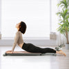 Pink multifunctional sit-up bench shown in use, highlighting adjustable angles and high-density cushion for effective.