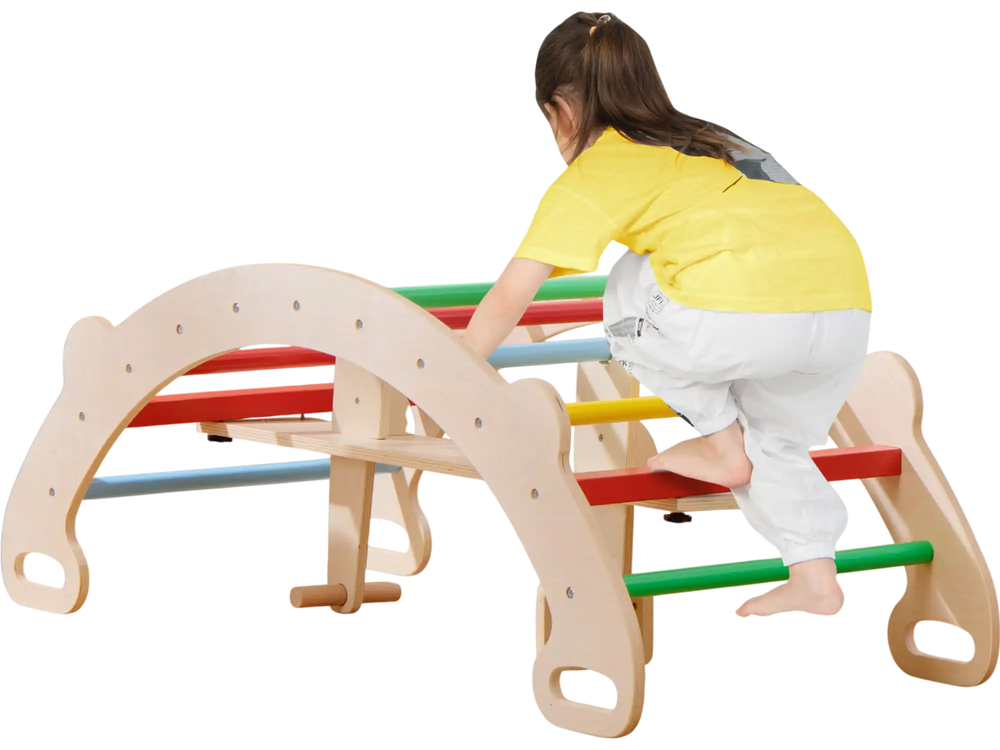 Multicolor wooden climbing toy with a supportive backrest, used as a rocker and arch climber for kids' physical.