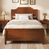 Solid wood platform bed frame in walnut finish features a sturdy headboard and under-bed clearance for extra storage.