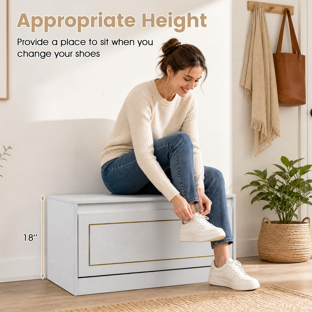 Narrow white shoe cabinet with flip drawer and adjustable shelf, providing a convenient seating area for changing shoes.