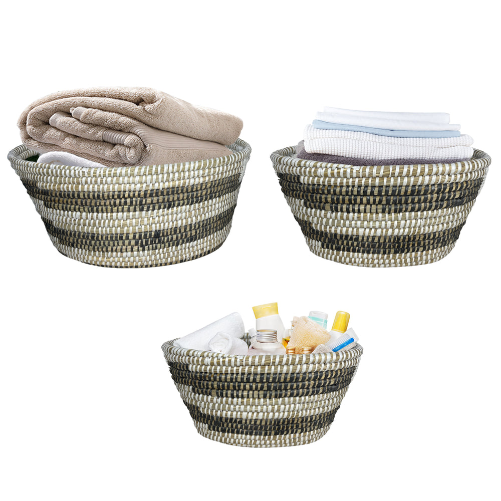 Set of 3 natural canes grass baskets with hollowed handles, ideal for stylish storage and organization in any room.