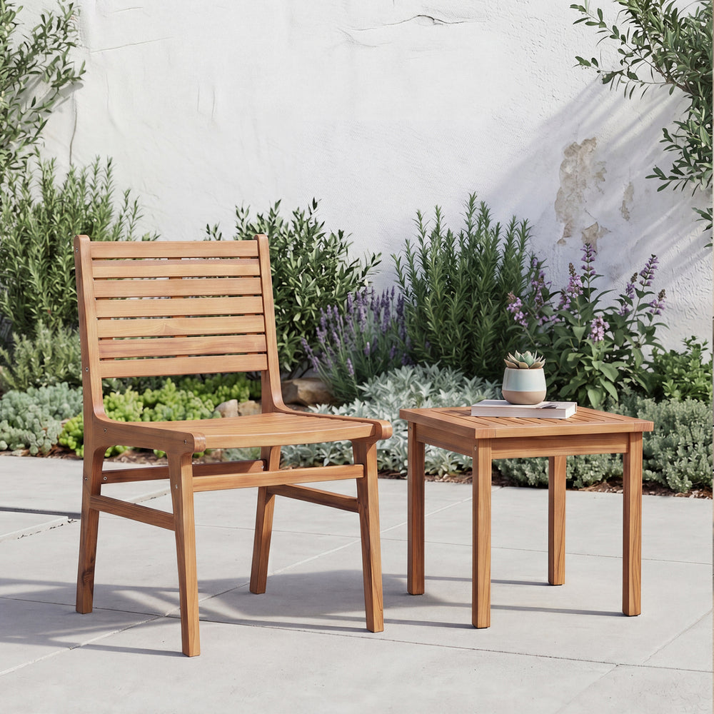 Natural wood armless patio chair with slanted back and slatted seat, perfect for outdoor relaxation on the patio.