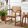 Natural wood patio armchair with slatted seat and slanted back, perfect for outdoor relaxation on the porch or balcony.