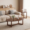 Nesting coffee table set featuring walnut wood veneer tops and solid rubberwood legs, perfect for stylish living room.