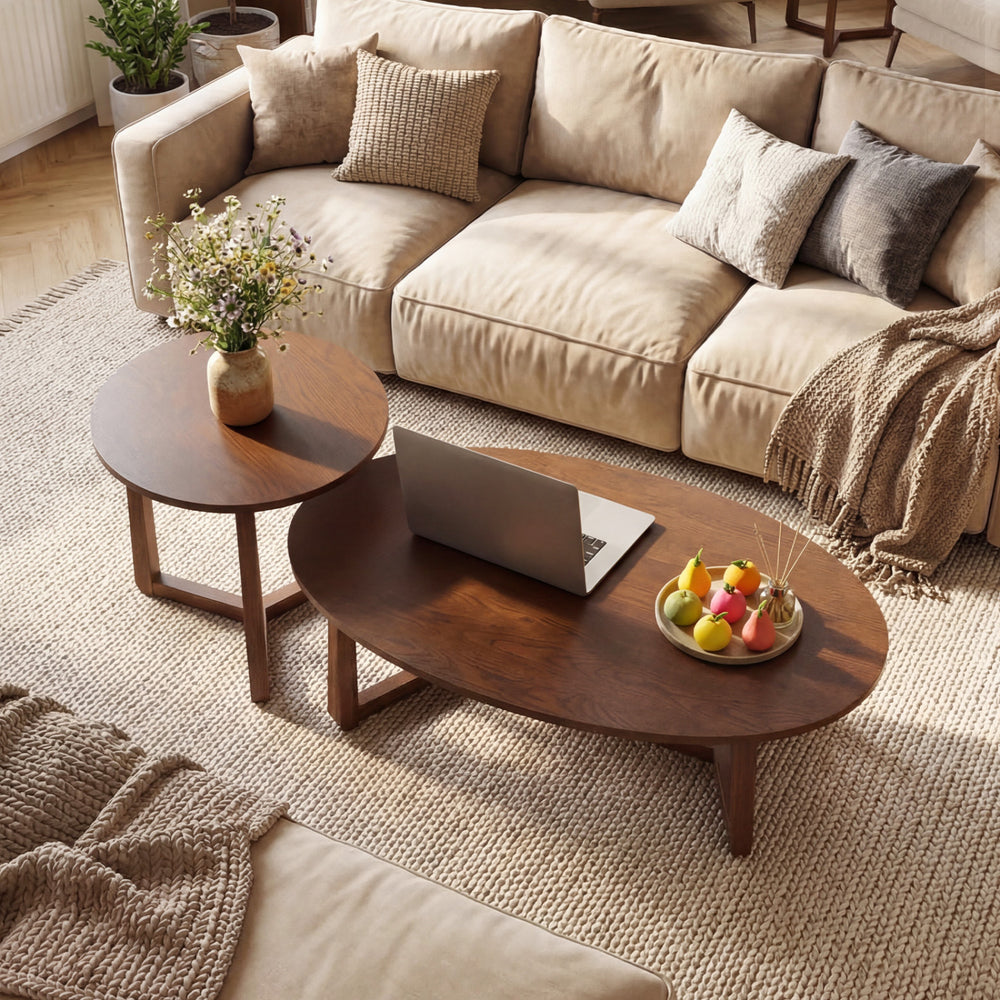 Nesting coffee table set featuring oval and round wood veneer tops with solid rubberwood legs, perfect for living room.