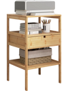 Bamboo nightstand with open shelves and drawer, ideal for storage in living room or bedroom.