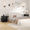 Modern black nightstand with charging station, sliding top storage, and three open compartments for organized bedside.