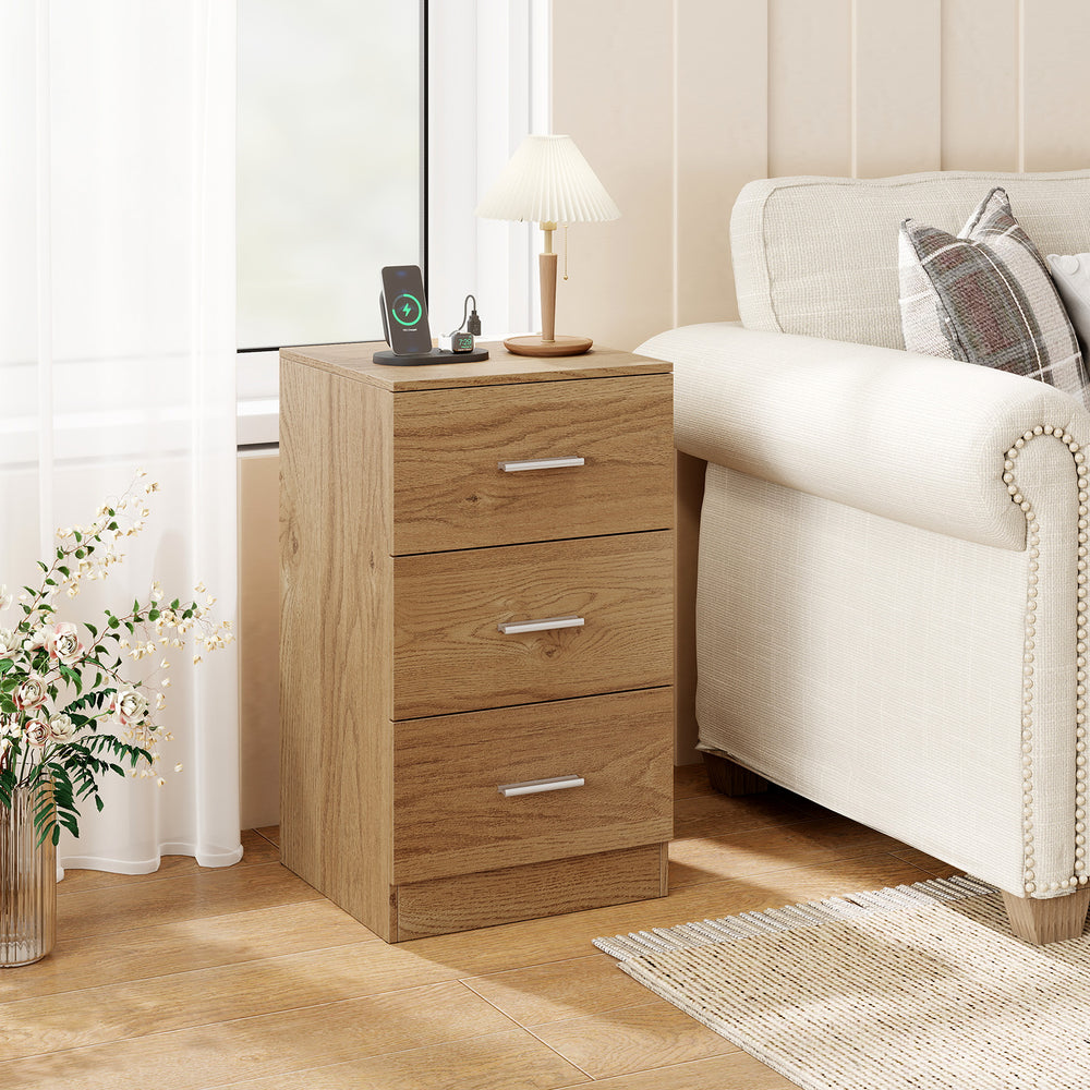 Natural wood nightstand with charging station, three storage drawers, and elegant design for bedroom organization.