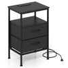 Modern black nightstand with charging station, two fabric drawers, and open shelf for versatile bedroom storage.
