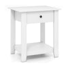 White nightstand with drawer and open shelf, featuring sturdy legs and contemporary design for bedroom or living room.