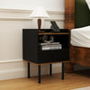 Black nightstand with drawer and open shelf, featuring metal legs, ideal for storage beside a sofa or bed.