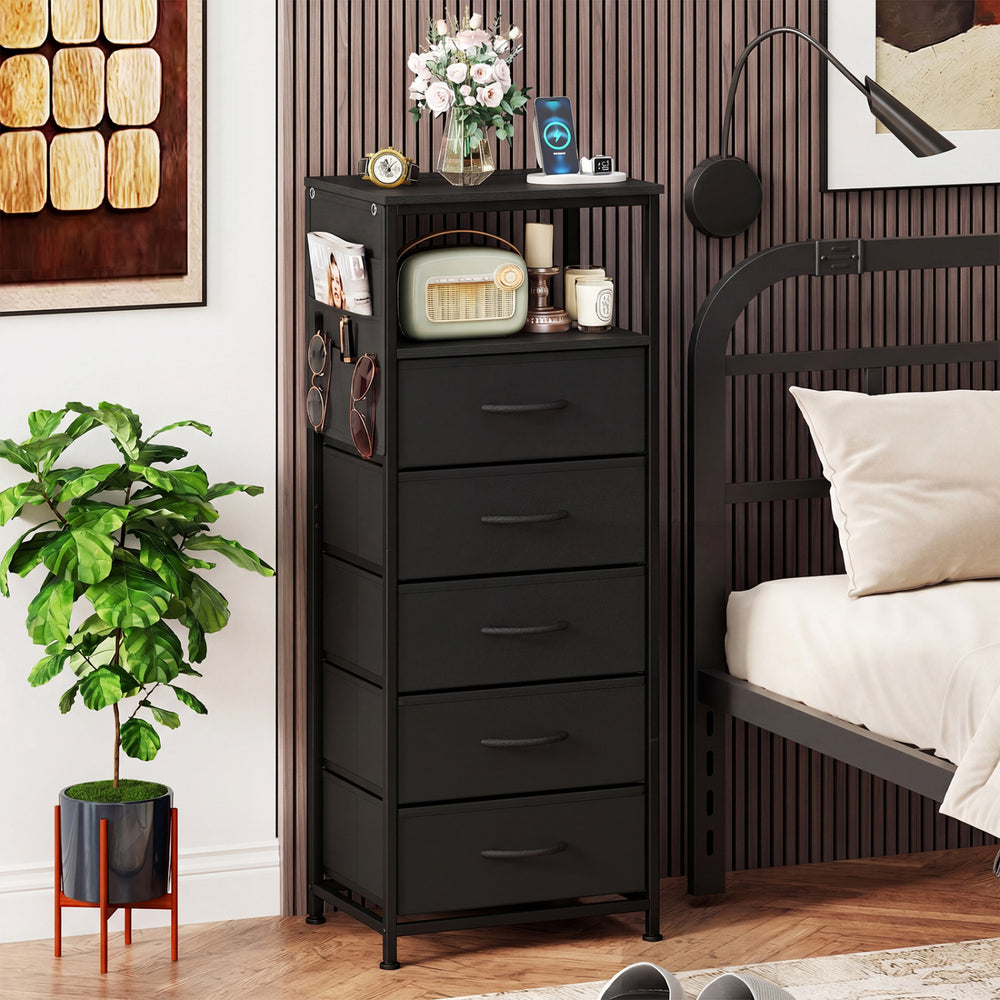 Black nightstand with integrated charging station, featuring a side pocket and convenient handles on each drawer for.
