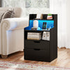 Nightstand in black with LED light, charging station, and ample storage, perfect for bedroom or living room.