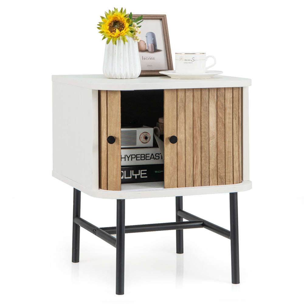 Mid-century modern nightstand with sliding doors, white finish, and wood accents, ideal for bedroom or living room.