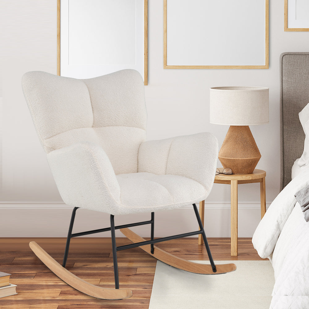 Nursery rocking chair in beige with plush upholstery, ergonomic design, and sturdy rubber wood base for cozy relaxation.