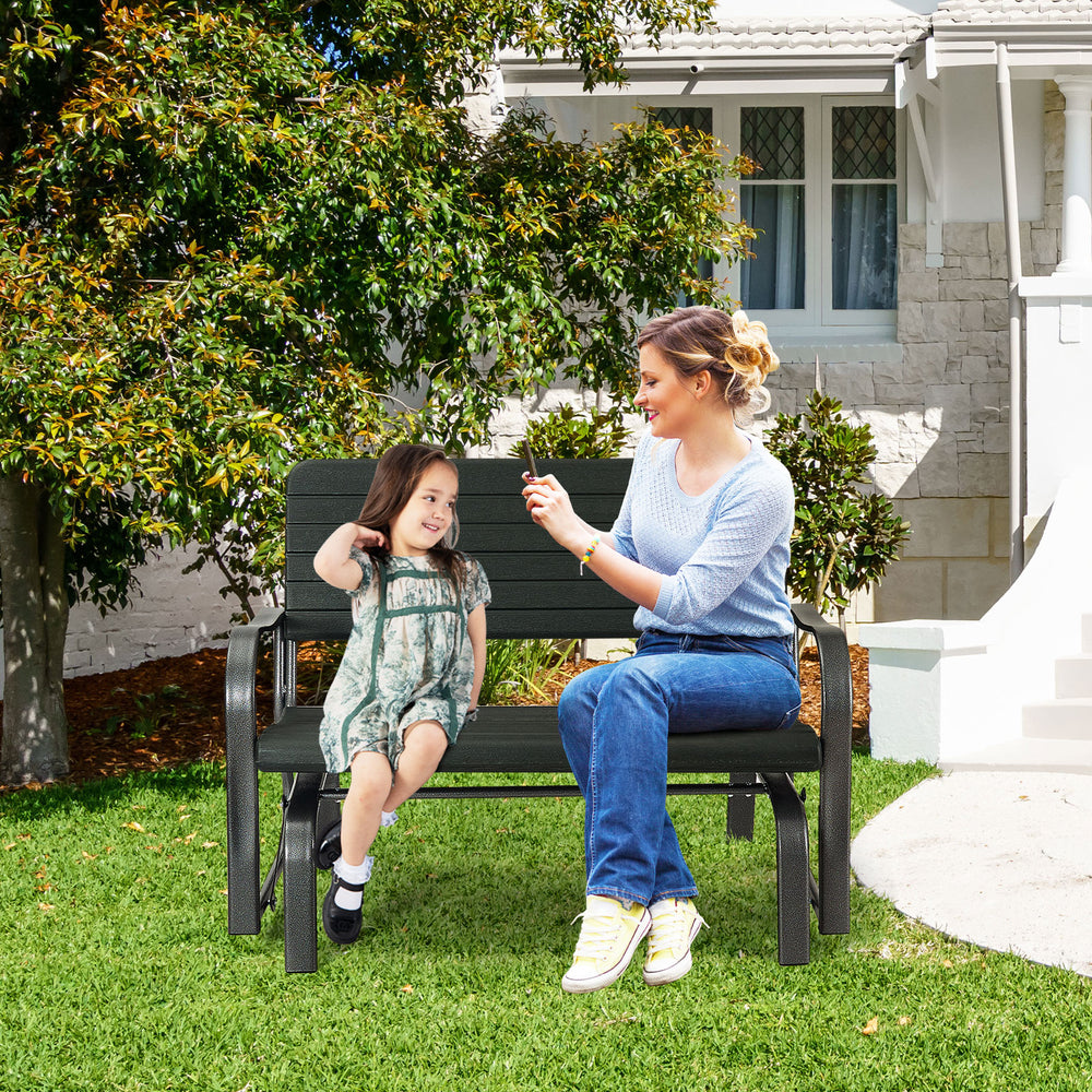 2-seat porch glider in black with ergonomic backrest, accommodating two people for backyard relaxation.
