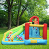 Brightly colored 6-in-1 inflatable bounce house with climbing wall and water slide, perfect for backyard fun.