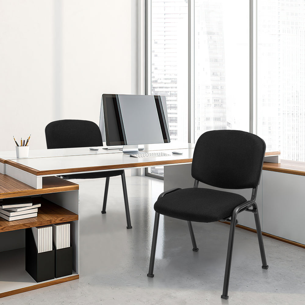 Black office chair with padded cushions and metal frame, designed for conference rooms and ergonomic support.