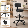 Black office drafting chair with adjustable footring, swivel seat, and 5-claw metal base for ergonomic support.