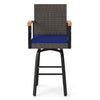 Outdoor 360° swivel bar stool features brown PE rattan, navy cushion, and acacia wood armrests for backyard comfort.