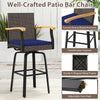 Outdoor 360° swivel bar stool features navy cushion, acacia wood armrests, and durable PE rattan for backyard comfort.