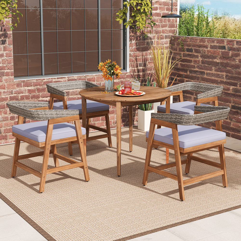 Set of 4 outdoor acacia wood dining chairs with gray wicker and soft cushions, perfect for backyard or poolside dining.
