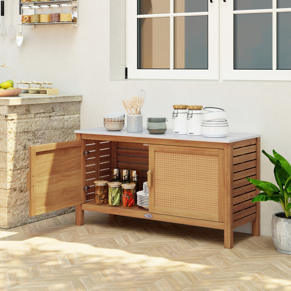 Acacia wood storage cabinet with faux marble top, showcasing rattan doors and ample storage for outdoor tools and.