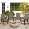 Four outdoor Adirondack chairs with high backs and metal frames arranged around a fire pit on a patio.