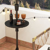 Adjustable 20-inch outdoor umbrella table with honey-comb design, holding drinks and snacks, ideal for patio use.