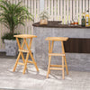 Set of 2 folding outdoor bar stools in teak wood with ergonomic saddle seats, perfect for patio or backyard use.