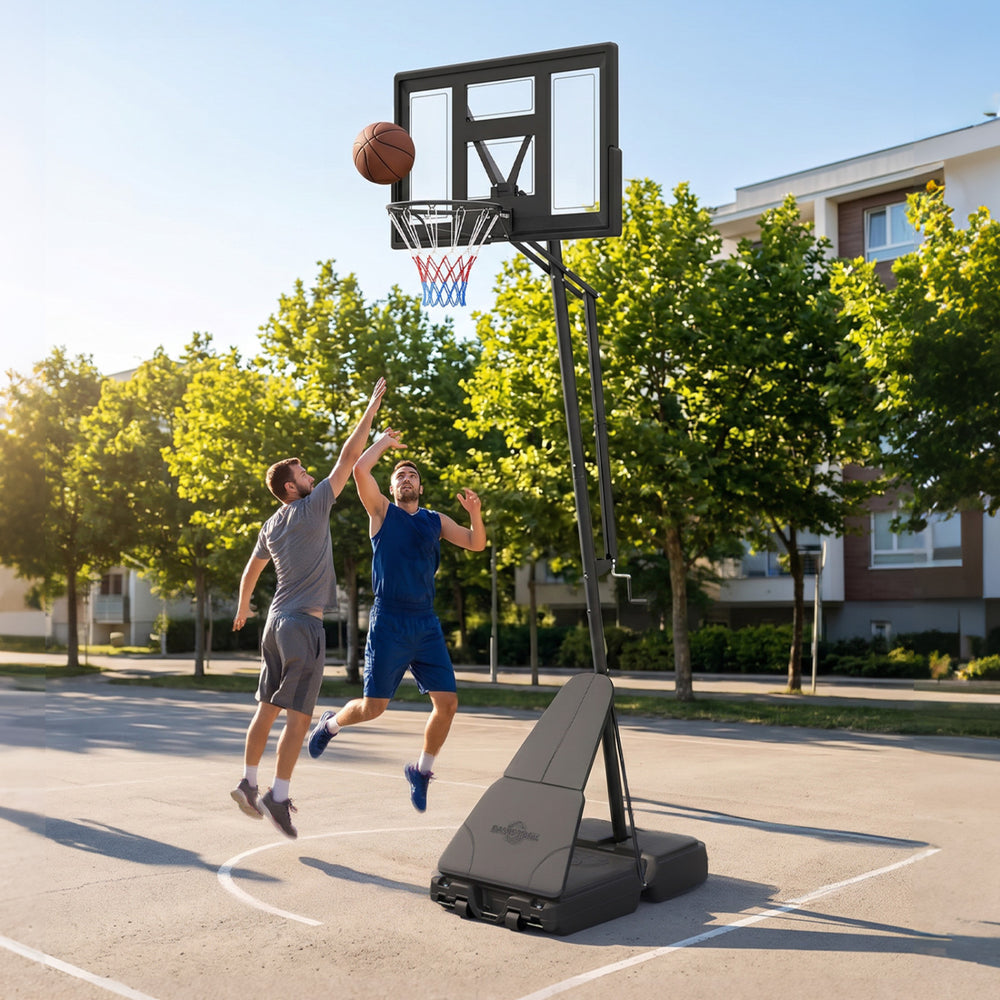 Height adjustable basketball goal system with shatterproof backboard, portable design, and players in action on the.