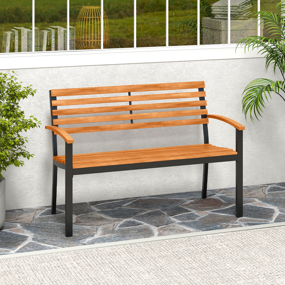 Acacia wood outdoor bench with backrest and armrests, perfect for patio seating for two in a stylish metal frame.