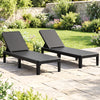 Set of 2 black outdoor chaise loungers with waterproof rattan textured surface, perfect for sunbathing and relaxation.