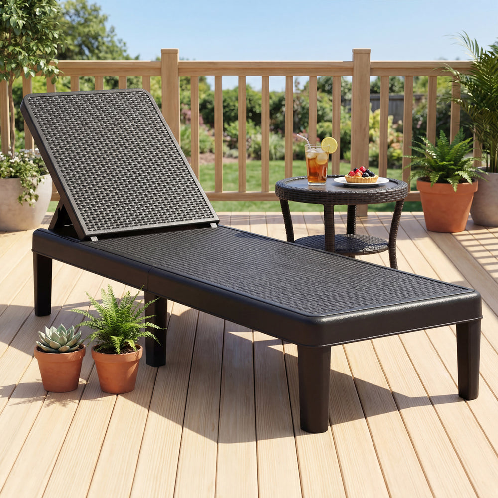 Black outdoor chaise lounger chair with waterproof rattan textured surface, adjustable backrest, perfect for sunbathing.