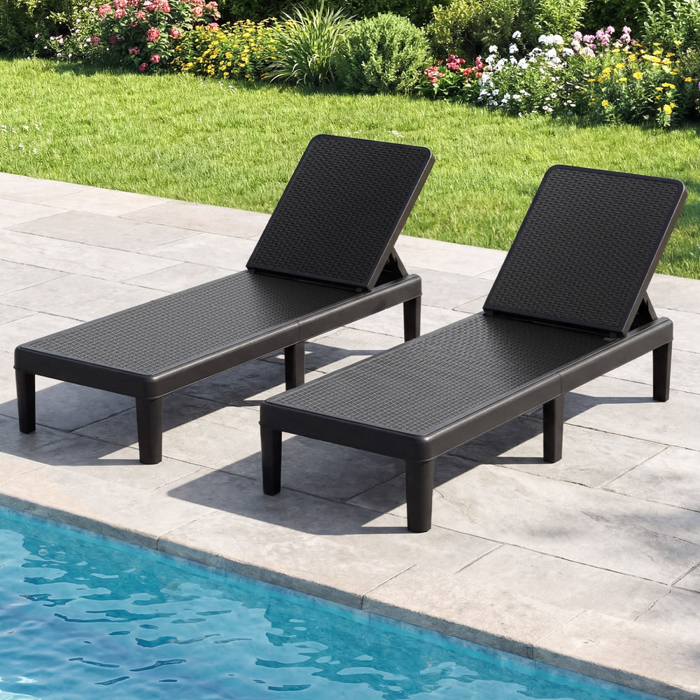 Black outdoor chaise lounger chairs with waterproof rattan texture, adjustable backrest, ideal for sunbathing by the.