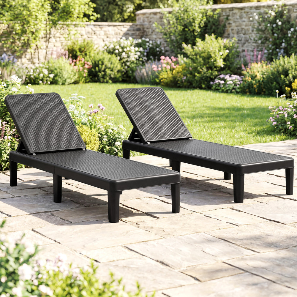 Black outdoor chaise lounger chairs with waterproof rattan textured surface, adjustable backrest, perfect for.