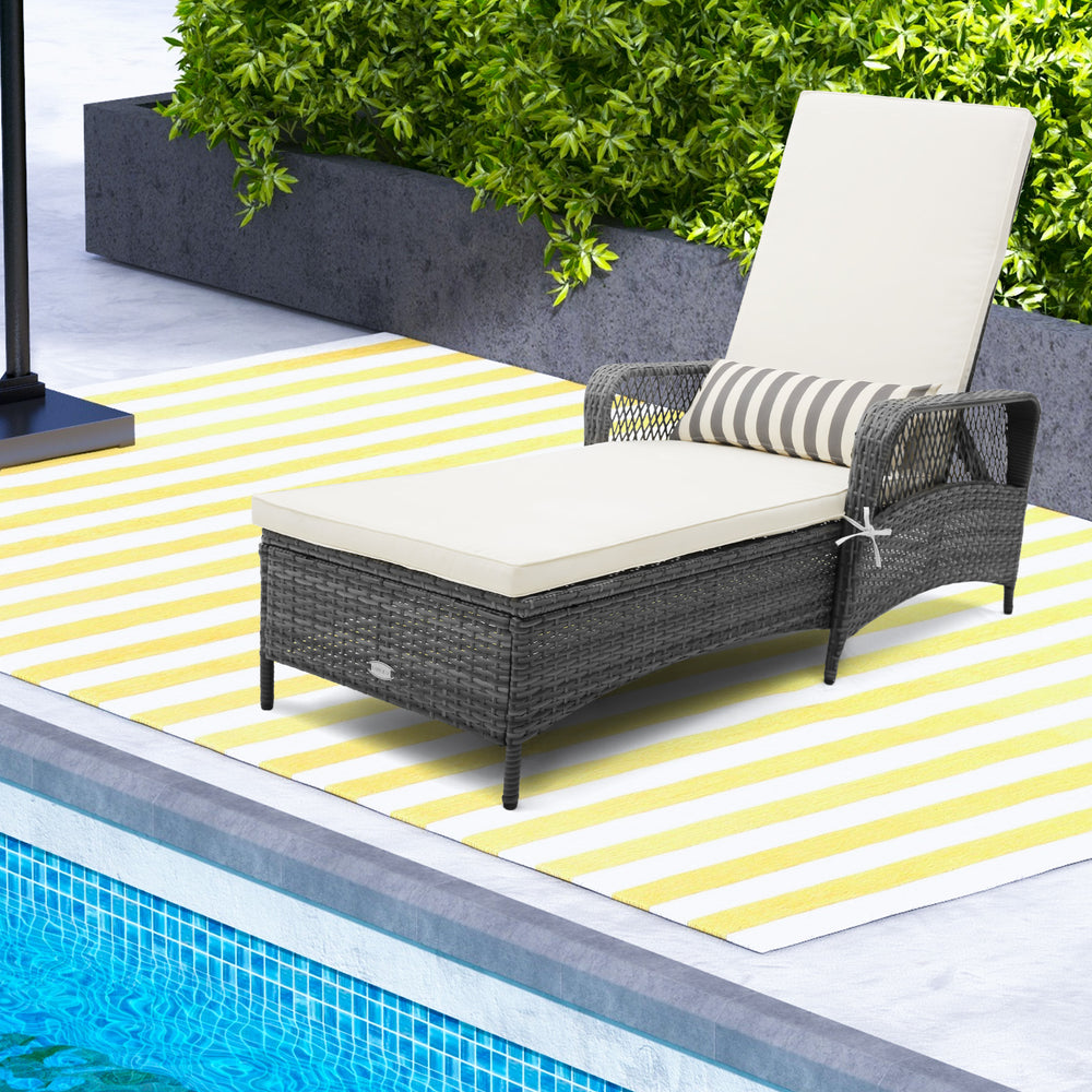 Outdoor chaise lounge chair recliner in gray PE rattan with cream cushion, perfect for poolside relaxation.