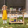 Outdoor fir wood play kitchen with blackboard, planting pots, and water box for imaginative cooking and gardening fun.