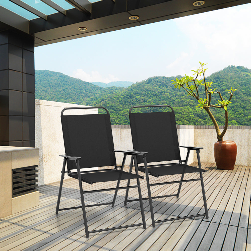 Two black outdoor folding sling chairs with armrests, set on a patio, perfect for comfortable outdoor seating.