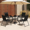Set of 4 black outdoor folding sling chairs with armrests, arranged around a table under an umbrella for outdoor.