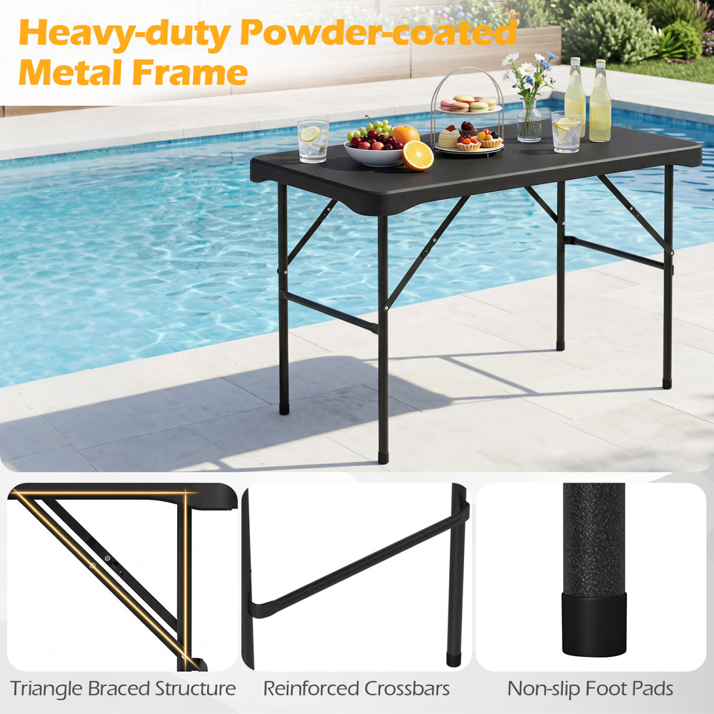 Outdoor folding table with a black HDPE tabletop and sturdy metal frame, ideal for picnics and camping.