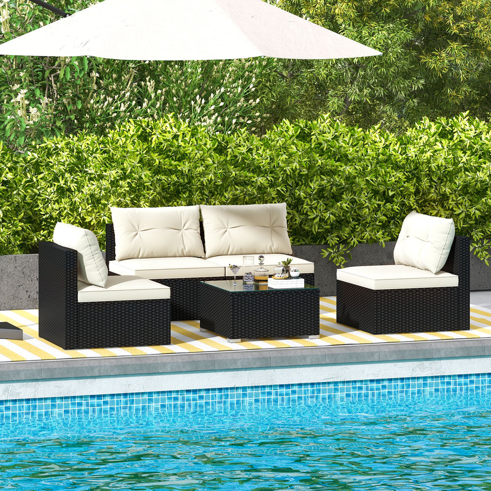5-piece outdoor patio furniture set with black PE wicker, soft cushions, and coffee table, ideal for poolside.